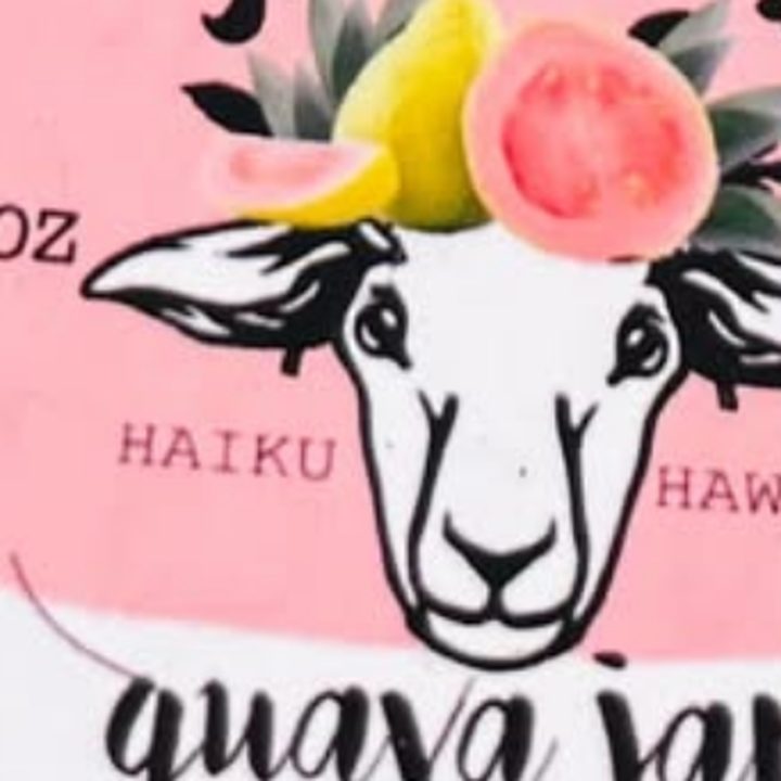 A guava jam lid printed with the sheep wearing a wreath of fruit and flowers