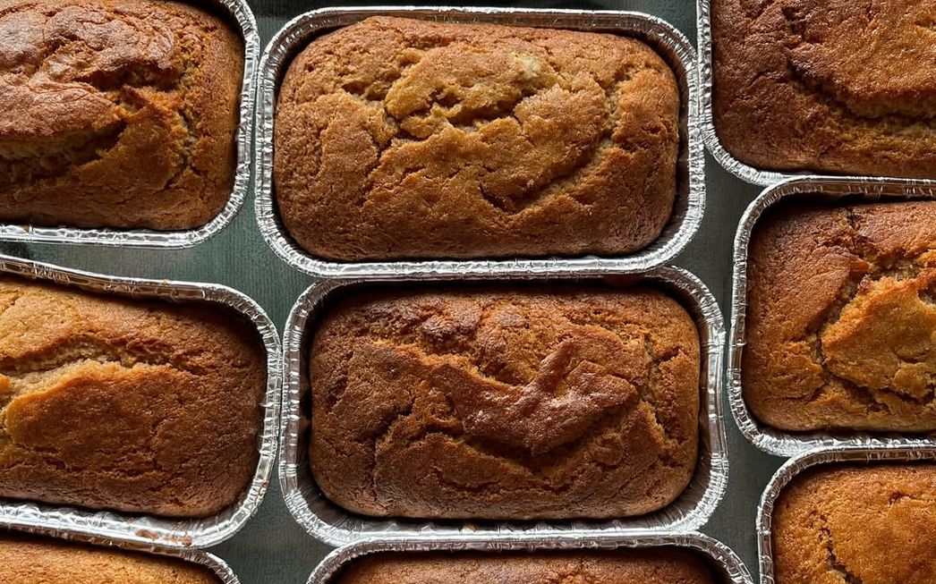 Loaves of banana bread in foil pans, seen from above